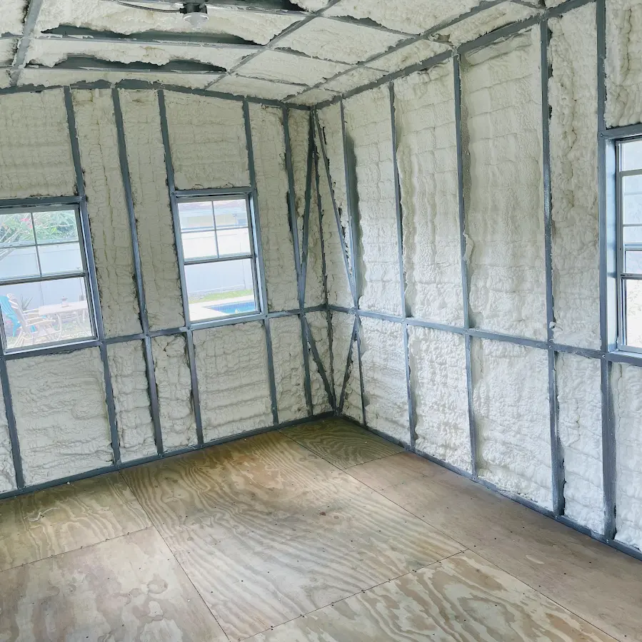 Closed-cell spray foam insulation applied to wall cavities in a residential project in Winslow